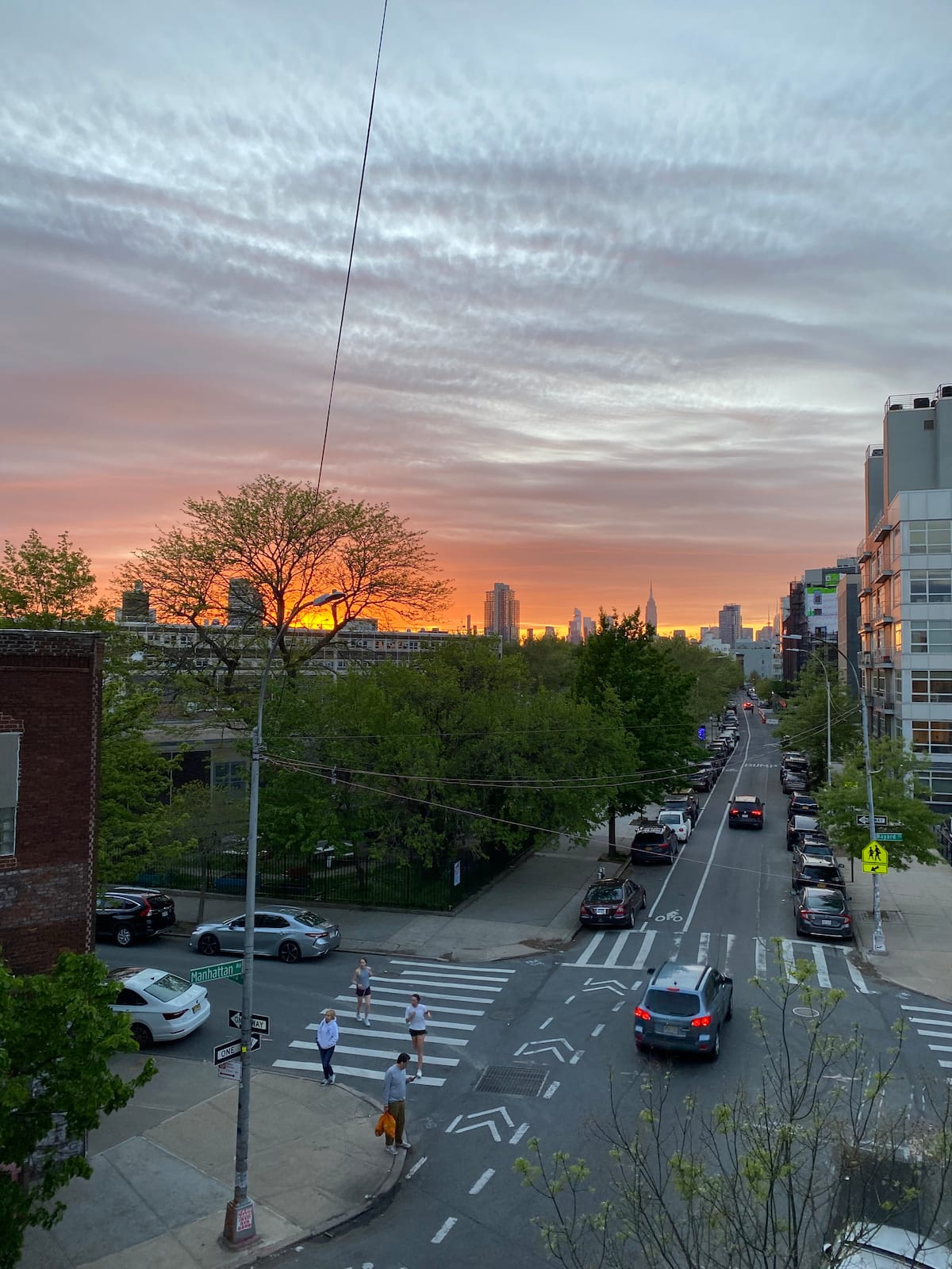 Greenpoint street at sunset with Manhattan skyline